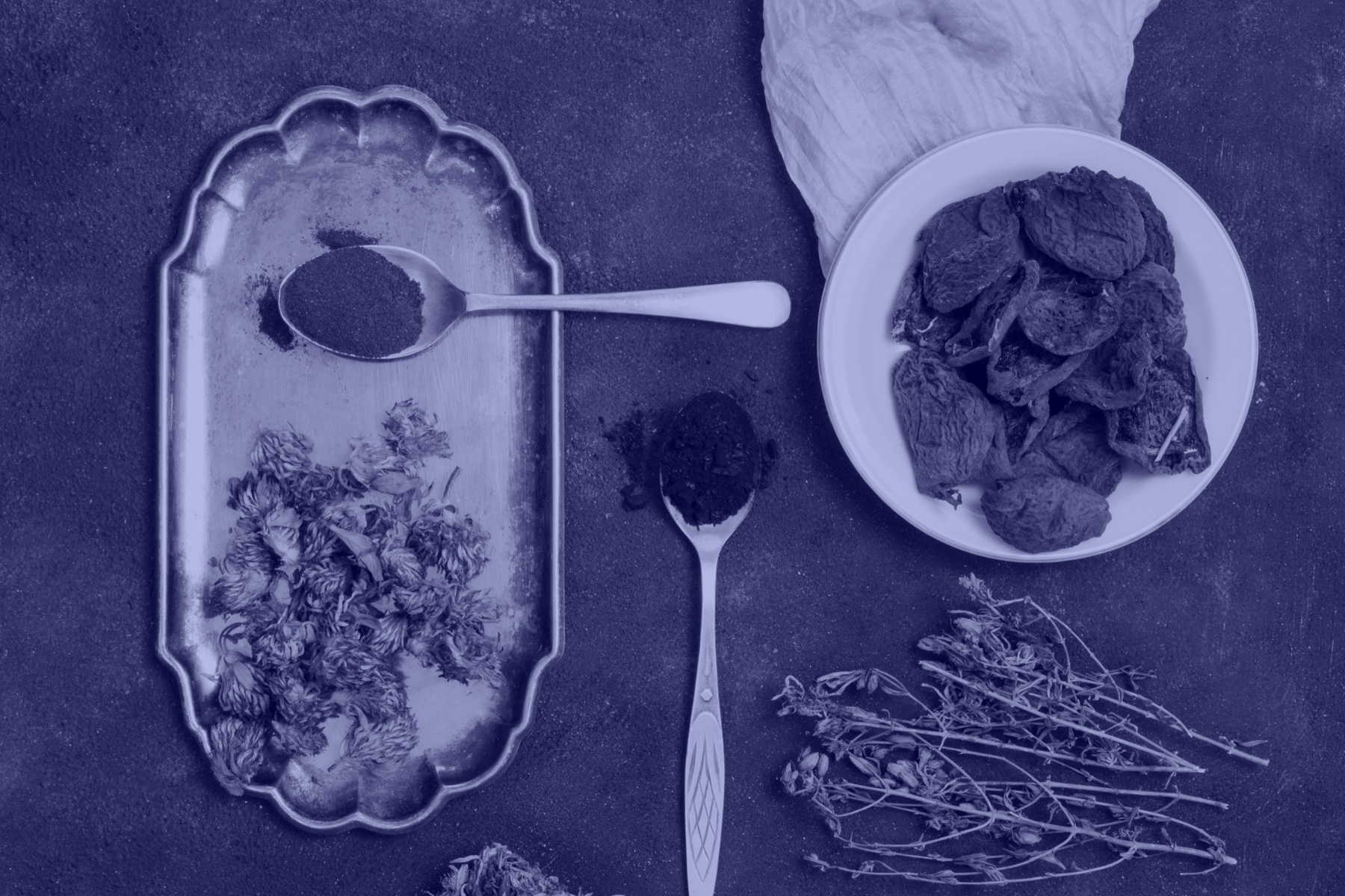 Herb roots and powders on a tray, the kind prepared in-house at the clinic